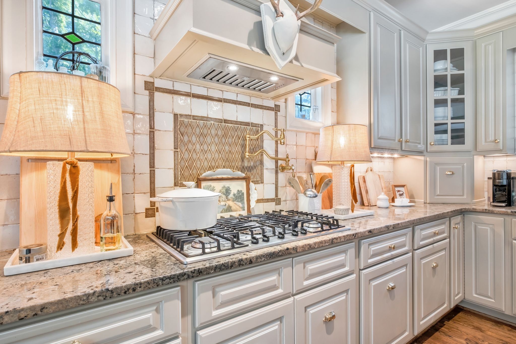 5468 Parker Branch Road Franklin, TN 37064 - Photo 23 of 99 a kitchen with stainless steel appliances granite countertop a sink a stove and a window