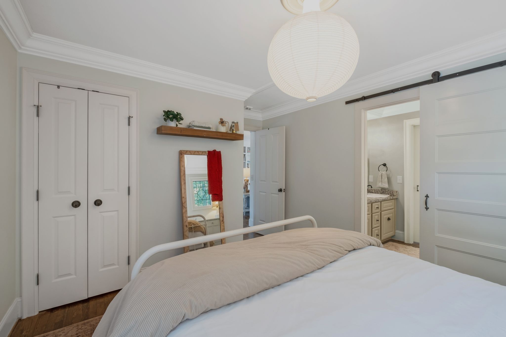 5468 Parker Branch Road Franklin, TN 37064 - Photo 54 of 99 a bedroom with a bed and a chandelier