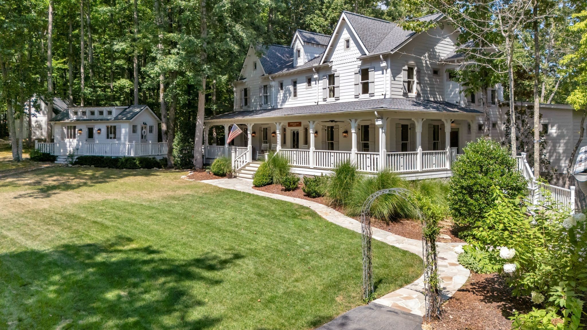 5468 Parker Branch Road Franklin, TN 37064 - Photo 99 of 99 a front view of a house with a garden and trees