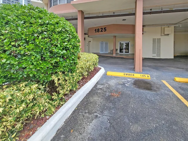 a view of a swimming pool with an outdoor seating
