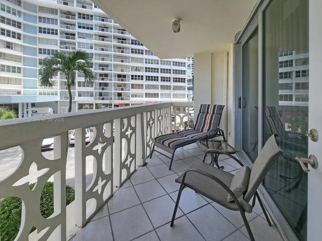 a view of balcony with furniture