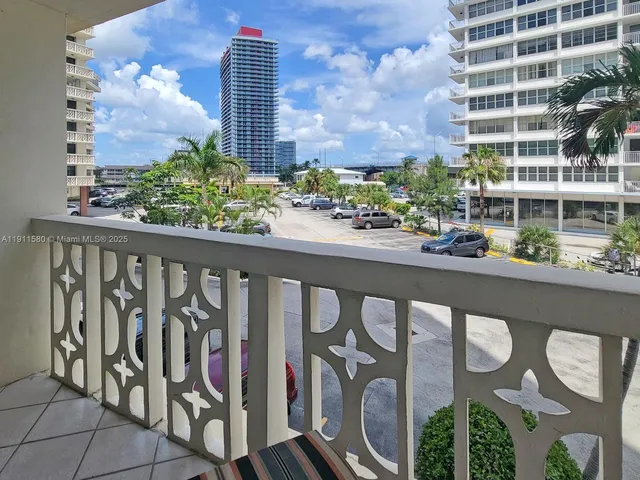 a view of a balcony with wooden floor