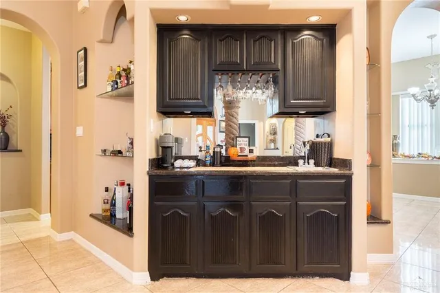 a kitchen with stainless steel appliances a sink and cabinets