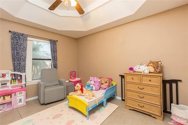 a bedroom with a bed and a couch