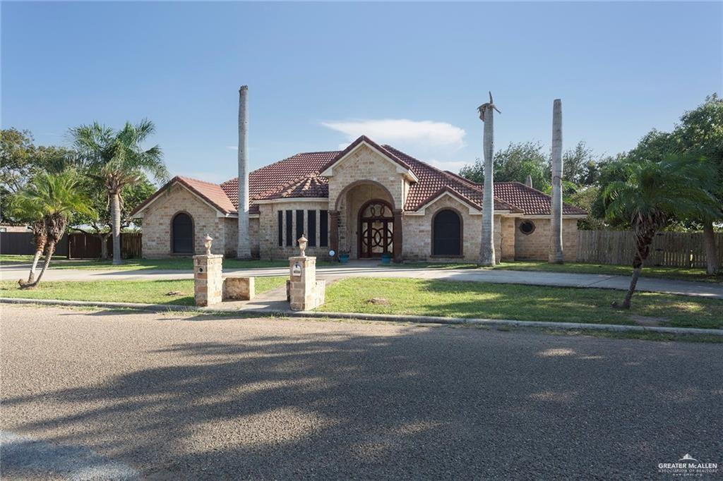 2802 South Pecan Boulevard Donna, TX 78537 - Photo 27 of 27 a view of a house with a big yard and palm trees