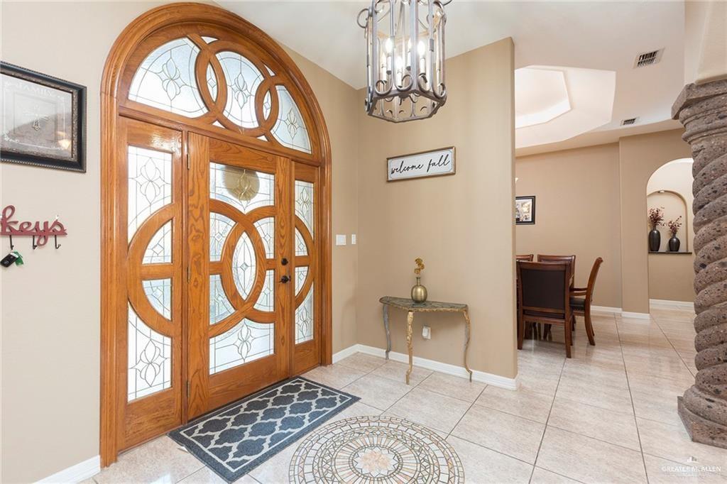 2802 South Pecan Boulevard Donna, TX 78537 - Photo 6 of 27 a view of an entryway with a chandelier