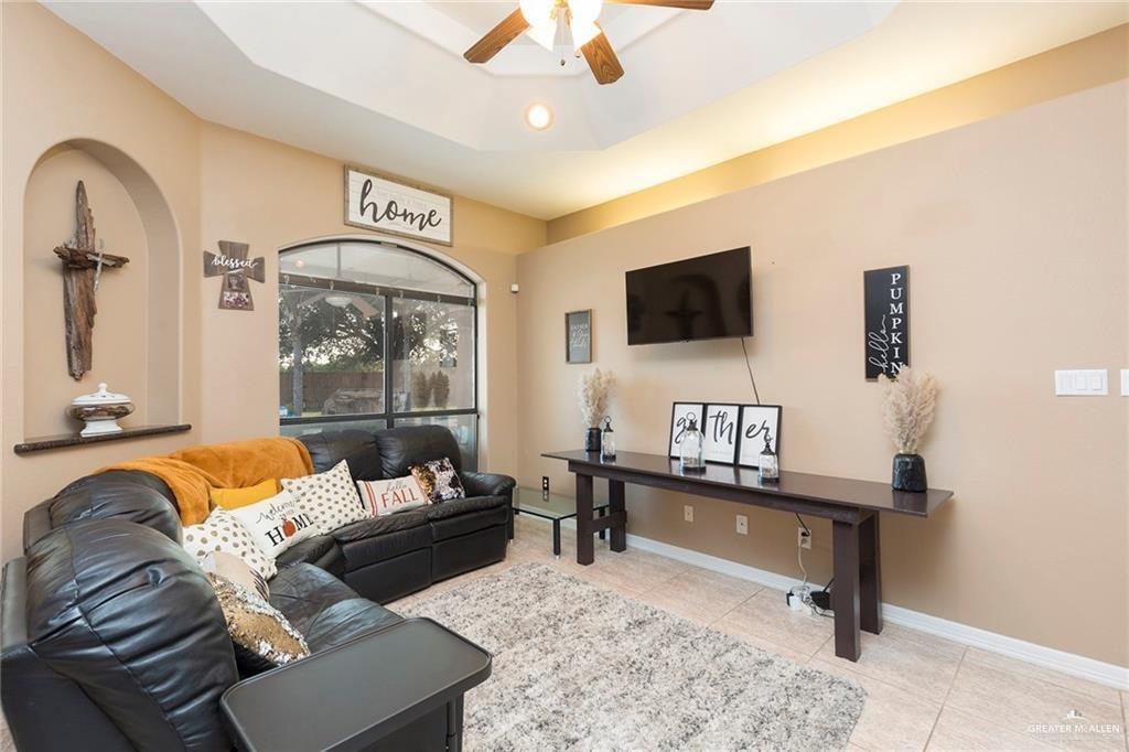 2802 South Pecan Boulevard Donna, TX 78537 - Photo 8 of 27 a living room with furniture and a flat screen tv