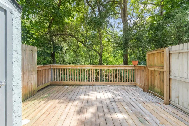 a view of deck with wooden floor and fence