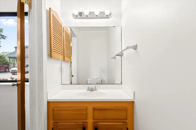 a bathroom with a sink and a mirror