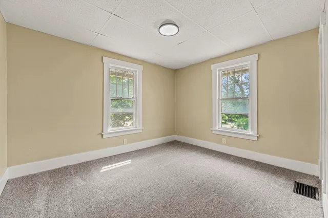 an empty room with windows