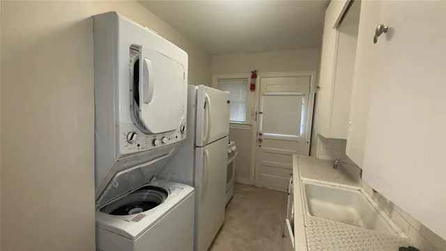 a bathroom with a sink and washing machine