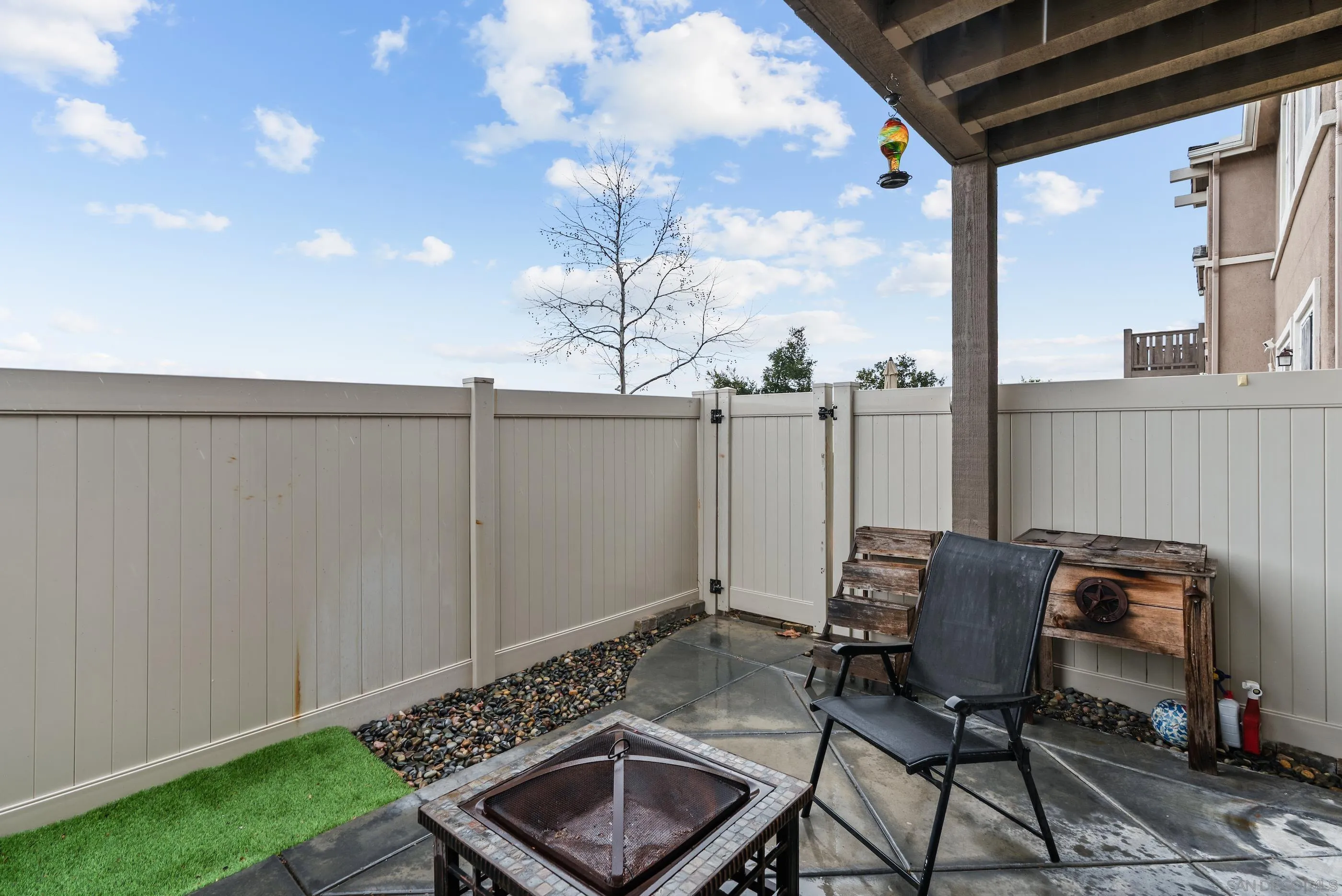 5481 San Roberto San Diego, CA 92154 - Photo 12 of 32 a view of chair and table in the back yard of the house