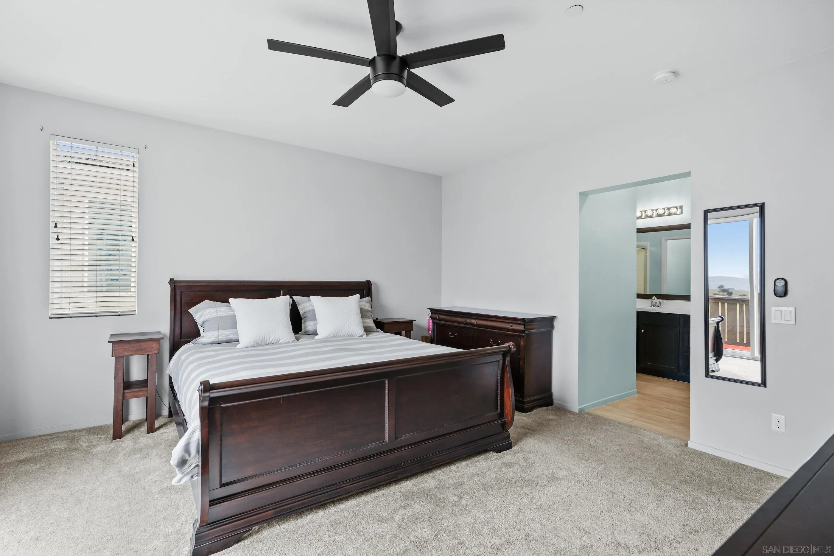 5481 San Roberto San Diego, CA 92154 - Photo 16 of 32 a bedroom with a bed and a dresser