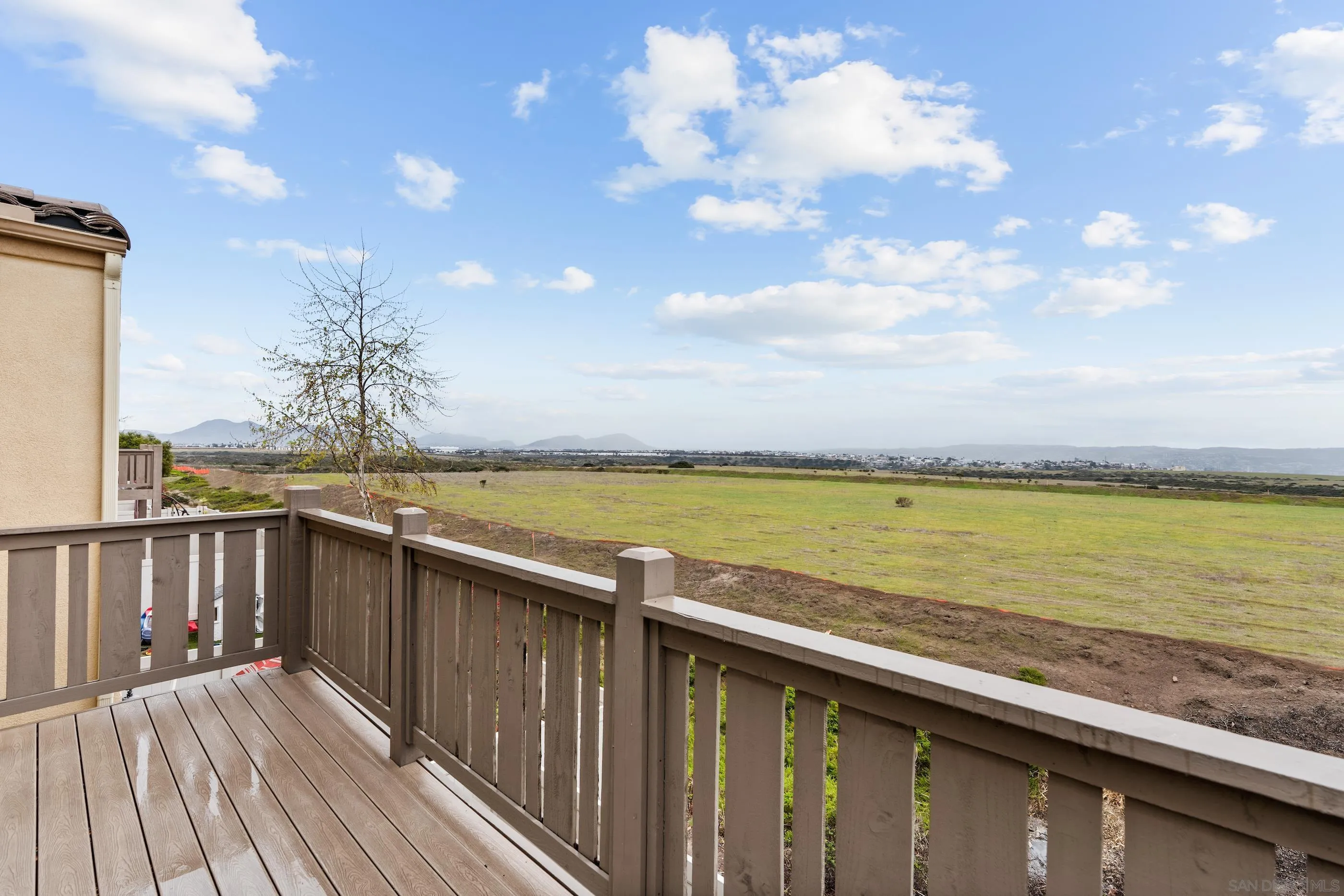 5481 San Roberto San Diego, CA 92154 - Photo 17 of 32 a view of a balcony with wooden floor and lake view