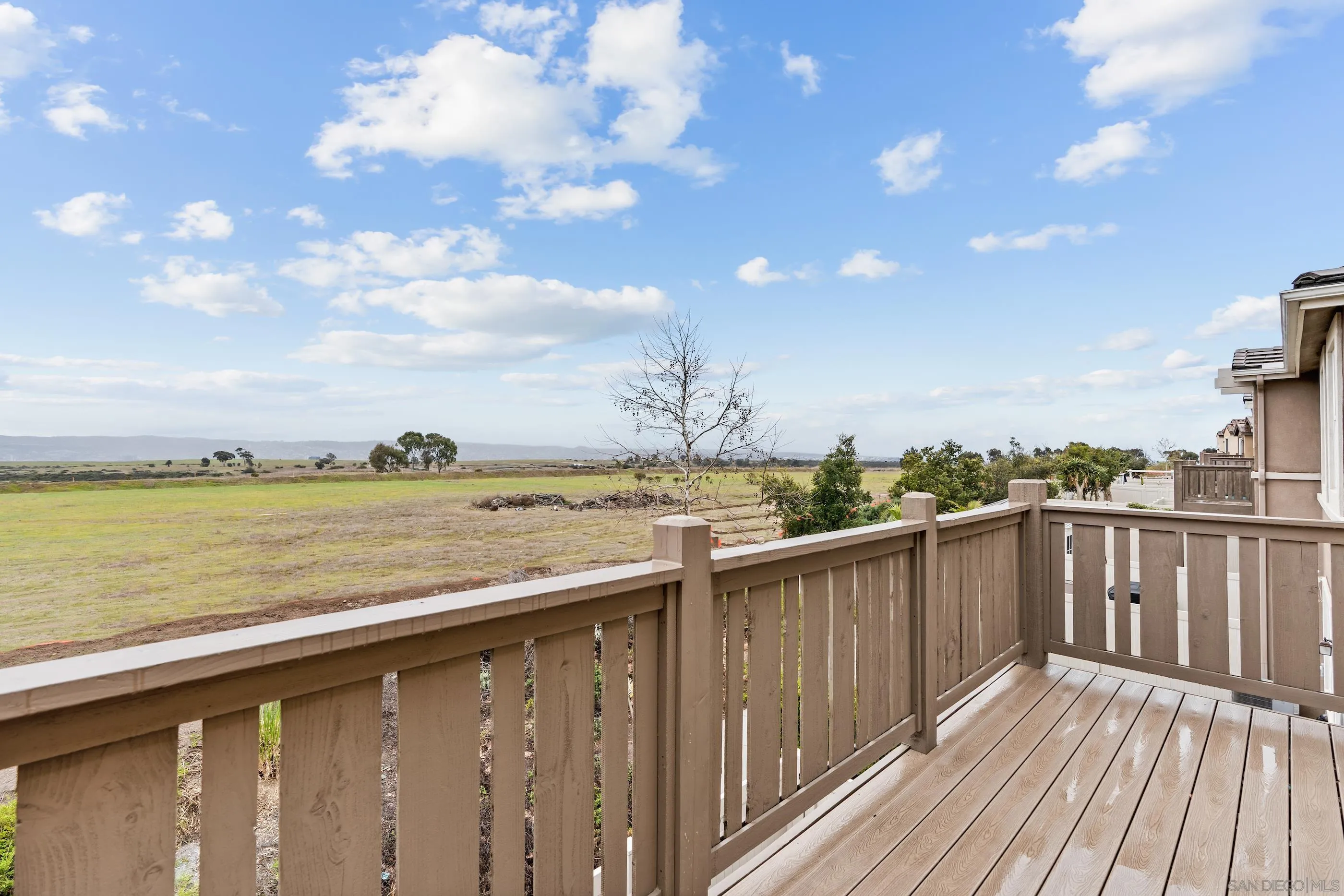 5481 San Roberto San Diego, CA 92154 - Photo 18 of 32 a view of a balcony with wooden floor and ocean view