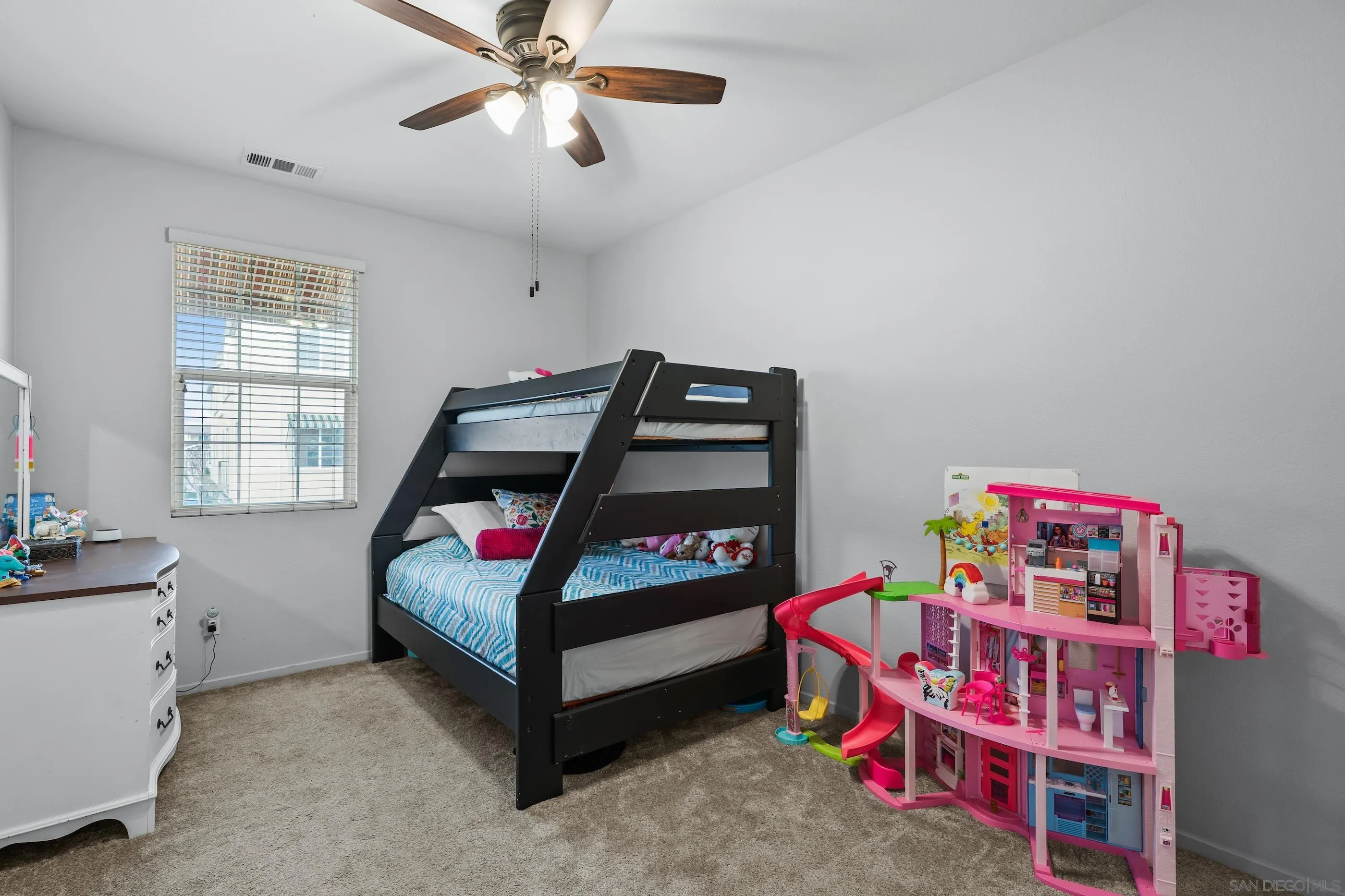 5481 San Roberto San Diego, CA 92154 - Photo 23 of 32 a bedroom with a bed and a wooden floor
