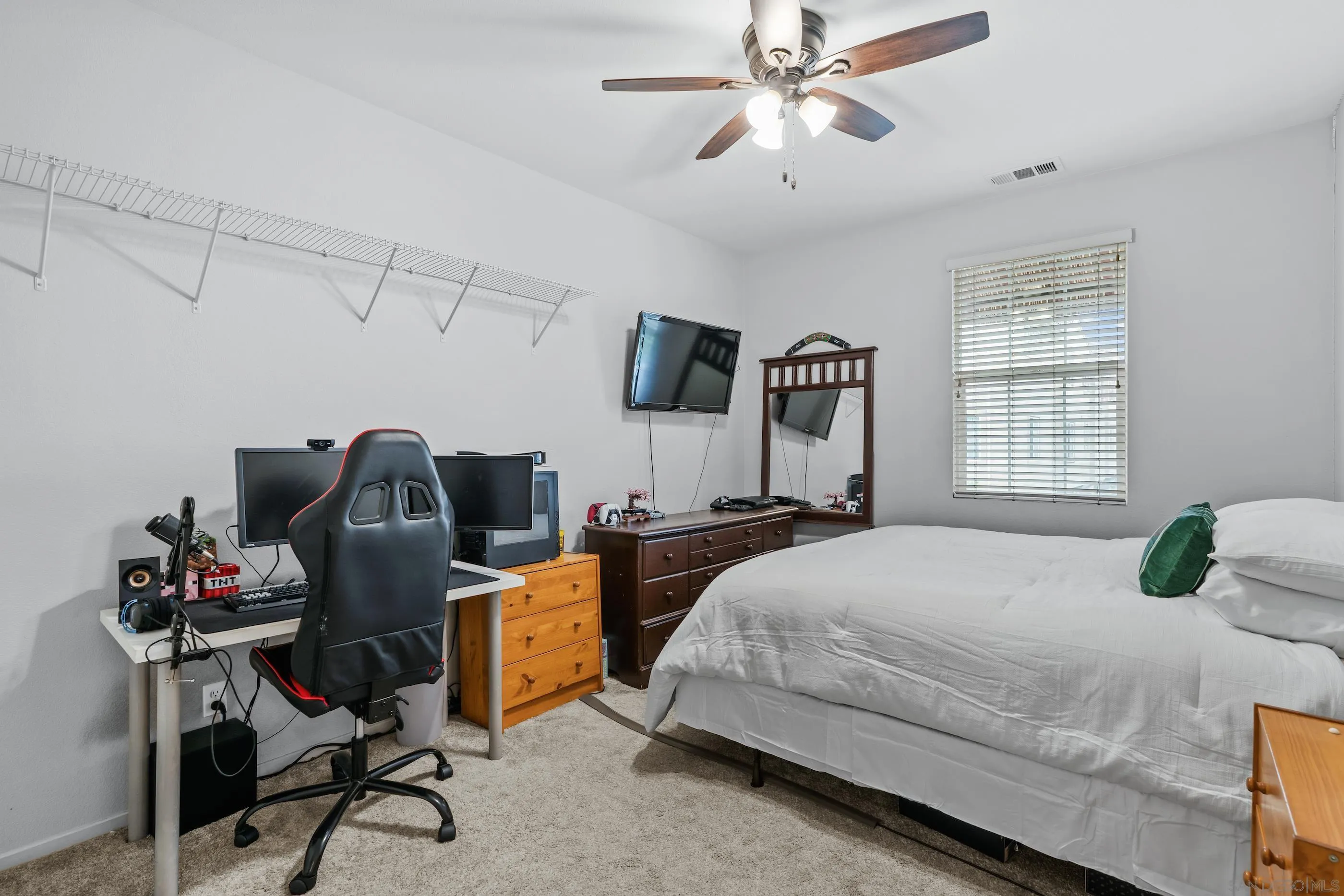 5481 San Roberto San Diego, CA 92154 - Photo 25 of 32 a bedroom with a bed and a chandelier