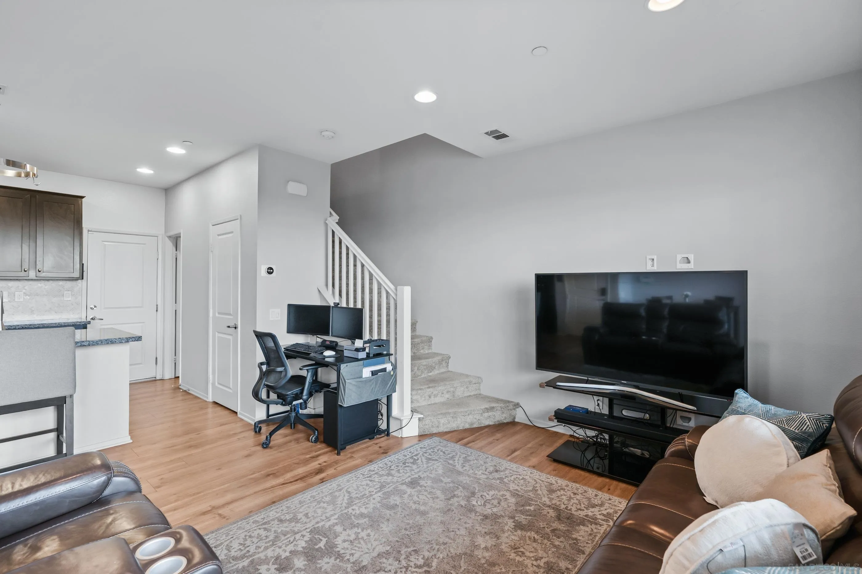 5481 San Roberto San Diego, CA 92154 - Photo 9 of 32 a living room with furniture and a flat screen tv