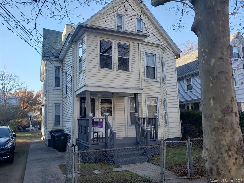a view of a brick house with many windows