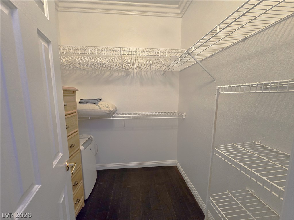 2050 West Warm Springs Road, Unit 2422 Henderson, NV 89014 - Photo 18 of 44 This organized walk-in closet offers ample storage with wire shelving and rich dark flooring.