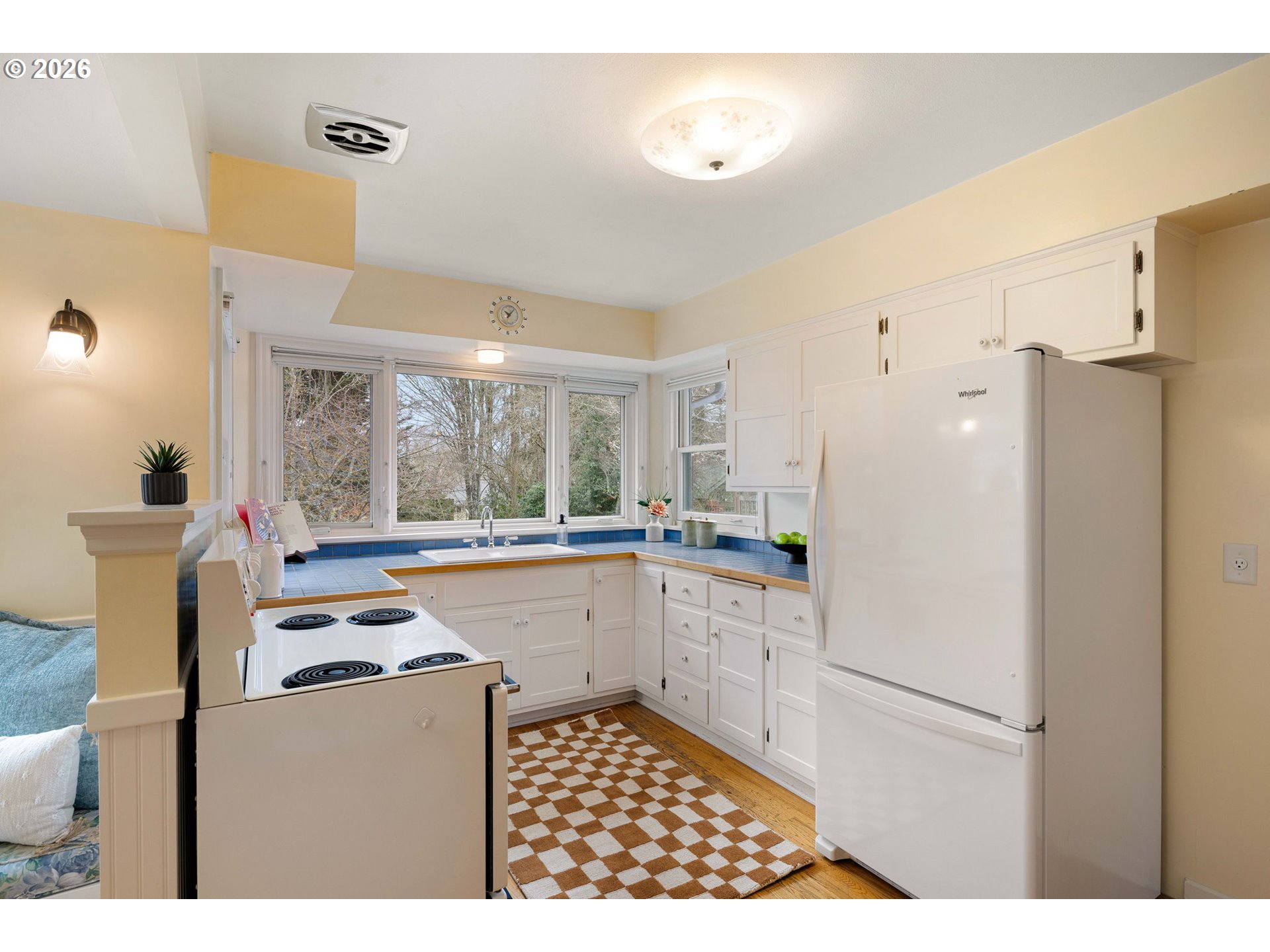 940 East 23rd Avenue Eugene, OR 97405 - Photo 25 of 48 a kitchen with a refrigerator a stove top oven a sink and a window