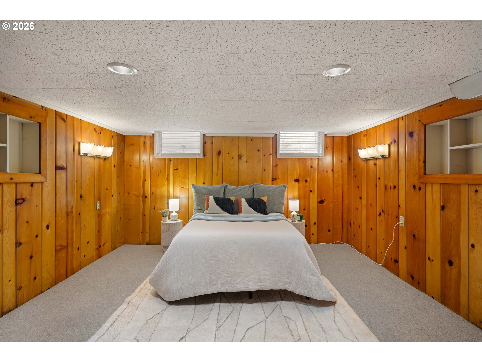 940 East 23rd Avenue Eugene, OR 97405 - Photo 38 of 48 a bedroom with a large bed and a chandelier