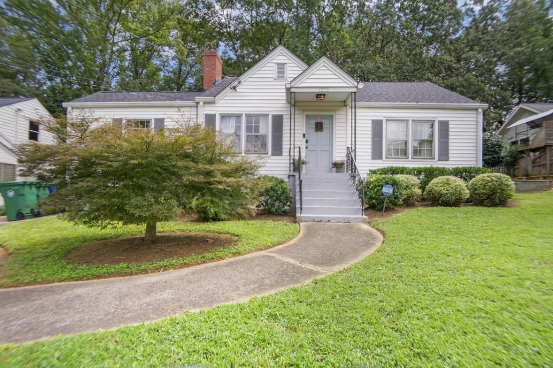 1232 Forrest Boulevard Decatur, GA 30030 - Photo 1 of 1 a front view of a house with a garden