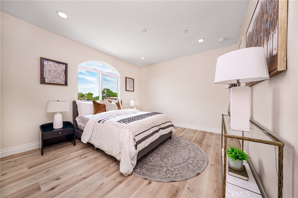 2709 Cogswell Road, Unit D El Monte, CA 91732 - Photo 14 of 57 a bedroom with a bed and a potted plant on dresser