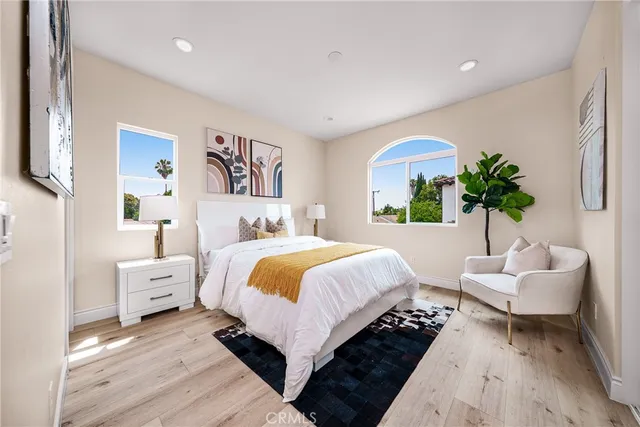 a bedroom with a large bed and a couch