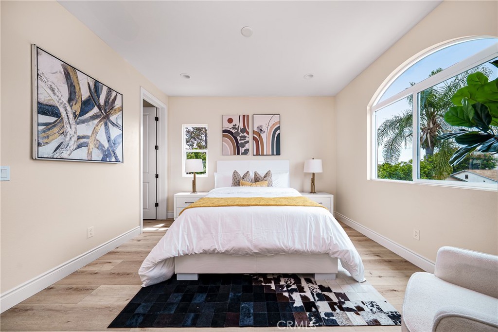 2709 Cogswell Road, Unit D El Monte, CA 91732 - Photo 17 of 57 a bedroom with a bed and a painting on the wall