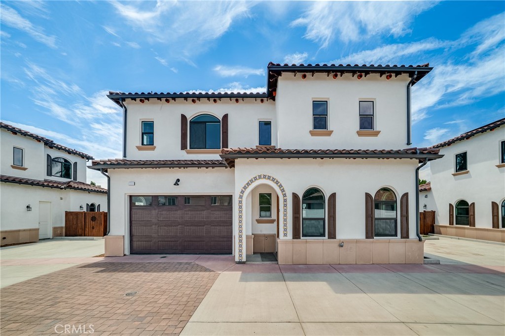 2709 Cogswell Road, Unit D El Monte, CA 91732 - Photo 24 of 57 a view of a white house with a sink and a garage