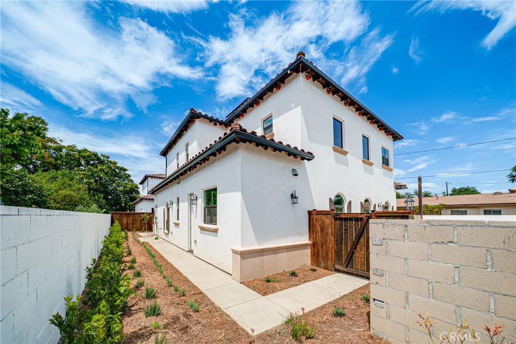 2709 Cogswell Road, Unit D El Monte, CA 91732 - Photo 32 of 57 a view of a house with a patio