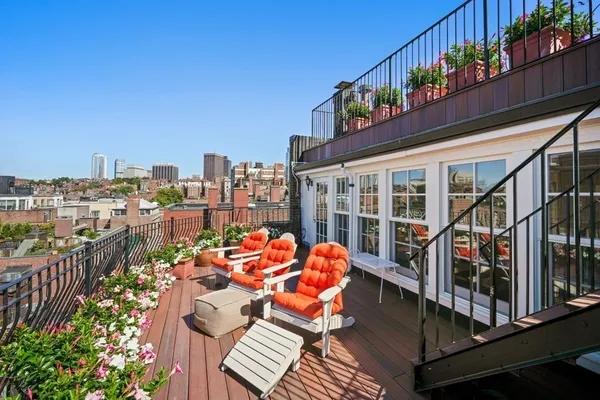 a view of a terrace with sitting area