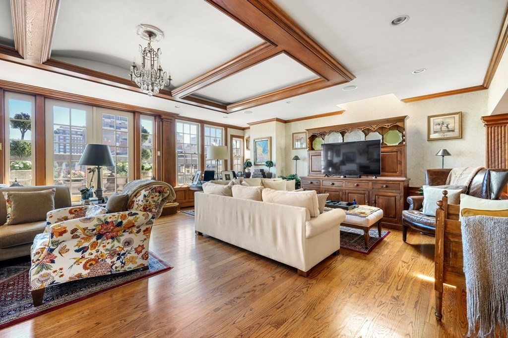 95 Beacon Street, Unit PH Boston, MA 02108 - Photo 2 of 14 a living room with furniture and a flat screen tv