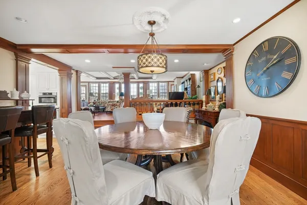 a view of a dining room with furniture wooden floor and chandelier