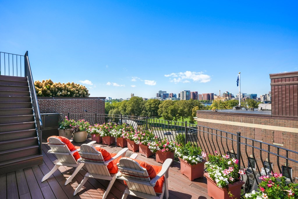 95 Beacon Street, Unit PH Boston, MA 02108 - Photo 5 of 14 a view of a chairs and table in a balcony