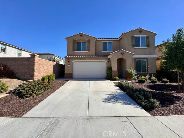 a front view of a house with yard