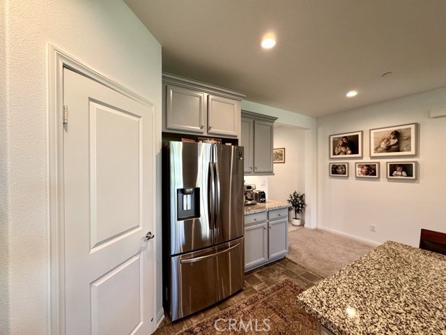 34110 Big Sur Drive Murrieta, CA 92563 - Photo 20 of 58 a kitchen with stainless steel appliances granite countertop a refrigerator and a sink