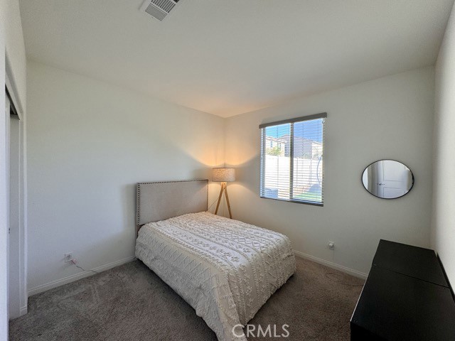 34110 Big Sur Drive Murrieta, CA 92563 - Photo 29 of 58 a bedroom with a bed and a window