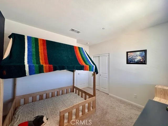 a white toilet sitting next to a shower