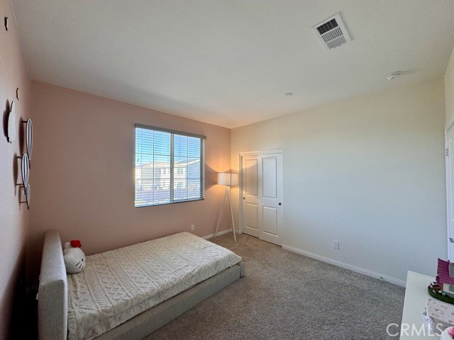 34110 Big Sur Drive Murrieta, CA 92563 - Photo 42 of 58 a bedroom with a bed and a window