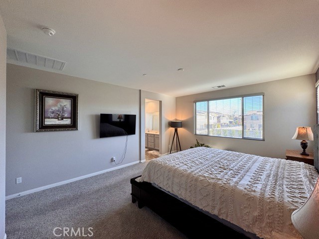 34110 Big Sur Drive Murrieta, CA 92563 - Photo 48 of 58 a bedroom with a bed and a flat screen tv