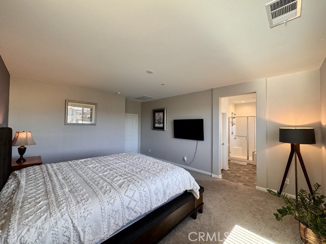 34110 Big Sur Drive Murrieta, CA 92563 - Photo 49 of 58 a bedroom with a bed and a flat screen tv