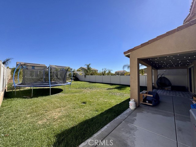 34110 Big Sur Drive Murrieta, CA 92563 - Photo 55 of 58 a view of swimming pool with a car parked in front of it