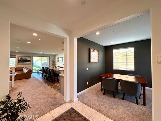 a living room with furniture a table and a window