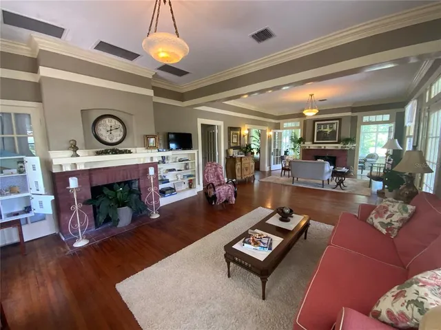 a utility room with dryer washer and a view of living room