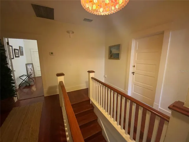 a view of yard with swimming pool and green space