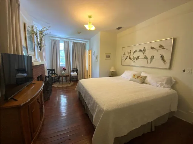 a view of a street with large trees