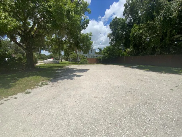 a building outdoor space with patio furniture and potted plants