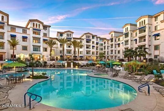 a swimming pool covered with outdoor seating